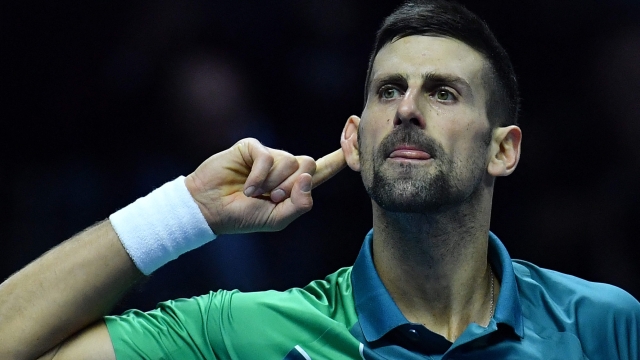 Serbia's Novak Djokovic reacts during the first round-robin match against Denmark's Holger Rune at the ATP Finals tennis tournament in Turin on November 12, 2023. (Photo by Tiziana FABI / AFP)