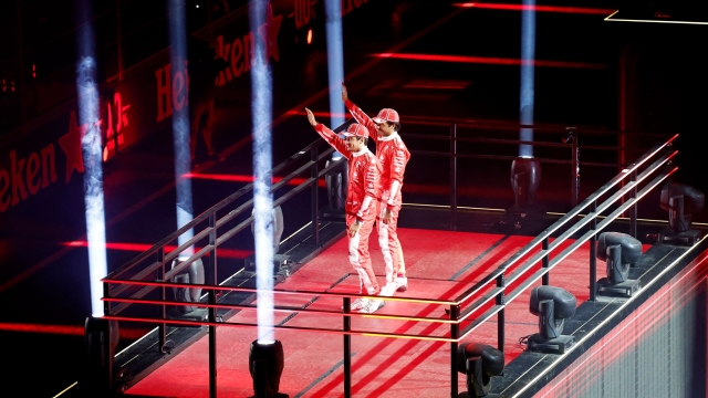 LAS VEGAS, NEVADA - NOVEMBER 15: Charles Leclerc of Monaco and Ferrari and Carlos Sainz of Spain and Ferrari are introduced at the Opening Ceremony during previews ahead of the F1 Grand Prix of Las Vegas at Las Vegas Strip Circuit on November 15, 2023 in Las Vegas, Nevada.   Chris Graythen/Getty Images/AFP (Photo by Chris Graythen / GETTY IMAGES NORTH AMERICA / Getty Images via AFP)