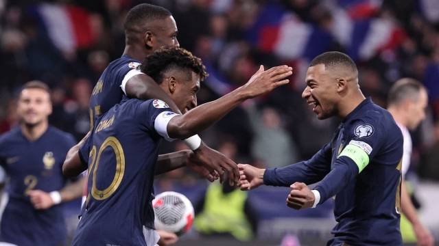 France's forward #20 Kingsley Coman (L) celebrates with France's forward #10 Kylian Mbappe after scoring a goal after scoring a goal during the UEFA EURO 2024 Group B qualifying football match between France and Gibraltar at the Allianz Riviera stadium in Nice, southeastern France, on November 18, 2023. (Photo by FRANCK FIFE / AFP)