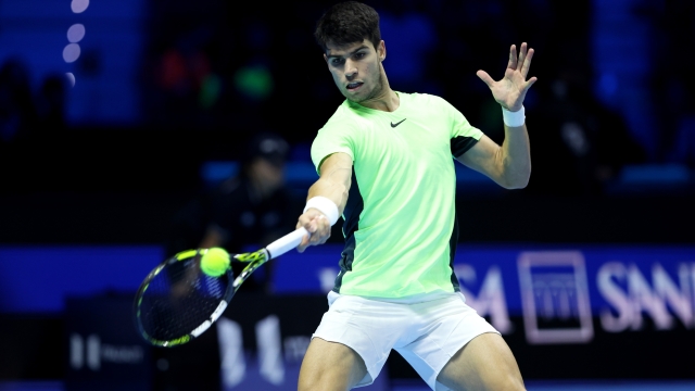 TURIN, ITALY - NOVEMBER 18: Carlos Alcaraz of Spain plays a forehand against Novak Djokovic of Serbia during the Men's Singles Semi Final match on day seven of the Nitto ATP Finals at Pala Alpitour on November 18, 2023 in Turin, Italy. (Photo by Clive Brunskill/Getty Images)
