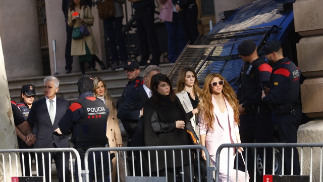 epa10985685 Colombian singer Shakira (R, in pink), accopanied by members of her defense team, leaves Barcelona Provincial Court on the first day of her trial for allegedly defrauding Spanish tax officials of 14.5 million euro in taxes between 2012 and 2014, in Barcelona city, Catalonia region, north-eastern Spain, 20 November 2023. Shakira has eventually secured a deal with Spanish prosecutors which means she avoids spending up to eight years in jail in exchange for paying a millionaire fine.  EPA/Quique Garcia