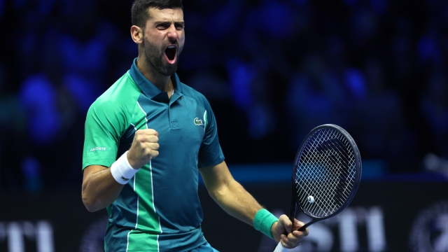 TURIN, ITALY - NOVEMBER 19: Novak Djokovic of Serbia celebrates winning match point against Jannik Sinner of Italy in the Men's Singles Finals between Jannik Sinner of Italy and Novak Djokovic of Serbia on day eight of the Nitto ATP Finals at Pala Alpitour on November 19, 2023 in Turin, Italy. (Photo by Clive Brunskill/Getty Images) *** BESTPIX ***
