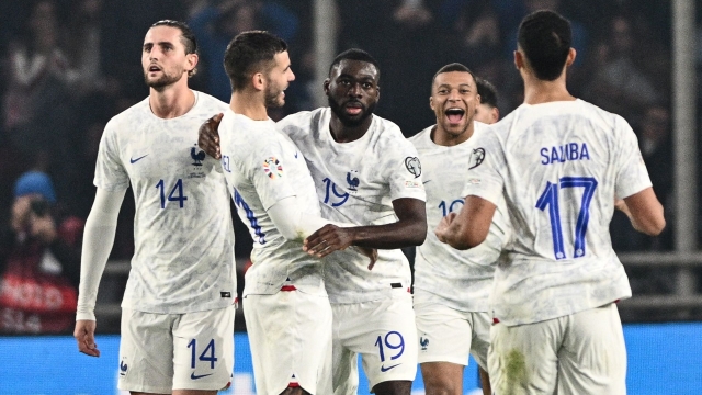 France's midfielder #19 Youssouf Fofana (C) celebrates with teammates after scoring his team's second goal during the UEFA Euro 2024 Group B second leg qualifying football match between Greece and France at the Agia Sophia Stadium in Athens on November 21, 2023. (Photo by Angelos Tzortzinis / AFP)