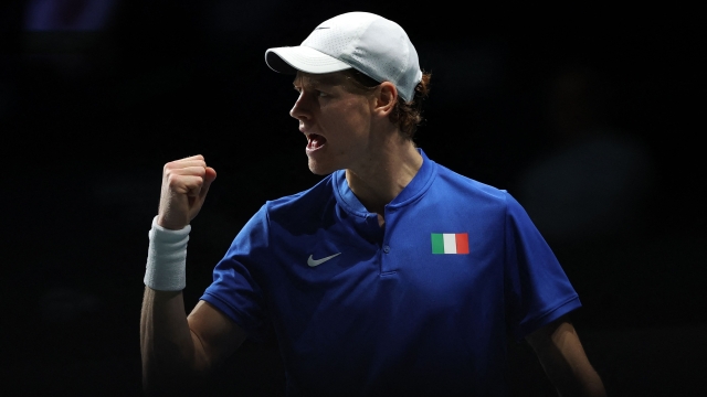 Italy's Jannik Sinner reacts as he plays against Netherlands' Tallon Griekspoor during the fourth men's single quarter-final tennis match between Italy and Netherlands of the Davis Cup tennis tournament at the Martin Carpena sportshall, in Malaga on November 23, 2023. (Photo by LLUIS GENE / AFP)