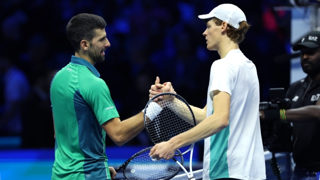 TURIN, ITALY - NOVEMBER 19: Novak Djokovic (L) of Serbia shakes hands with Jannik Sinner of Italy following the Men's Singles Finals between Jannik Sinner of Italy and Novak Djokovic of Serbia on day eight of the Nitto ATP Finals at Pala Alpitour on November 19, 2023 in Turin, Italy. (Photo by Clive Brunskill/Getty Images)