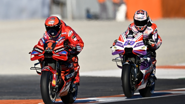 Ducati Spanish rider Jorge Martin (R) and Ducati Italian rider Francesco Bagnaia take part in the second free practice session of the MotoGP Valencia Grand Prix at the Ricardo Tormo racetrack in Cheste, on November 24, 2023. (Photo by JAVIER SORIANO / AFP)