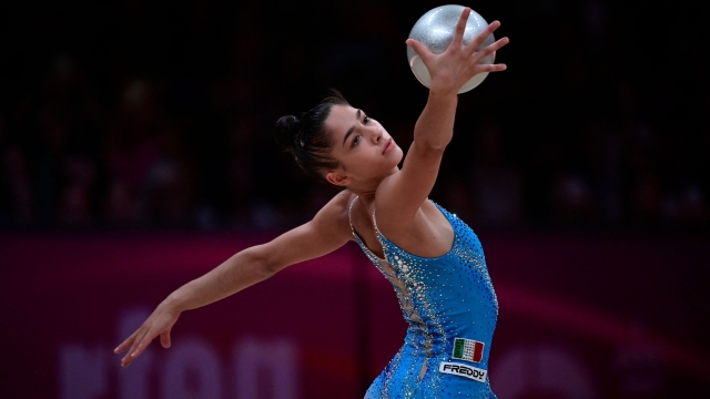 Italy's Sofia Raffaeli competes in the individual all-around event of the Olympic qualifier 40th FIG Rhythmic Gymnastics World Championships in Valencia on August 26, 2023. (Photo by JOSE JORDAN / AFP)
