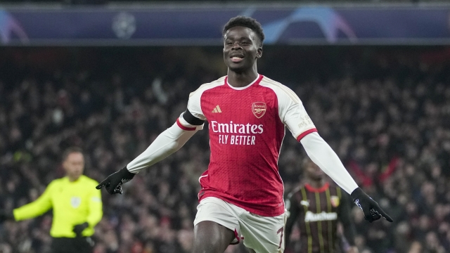 Arsenal's Bukayo Saka celebrates after scoring his side's third goal during the Champions League Group B soccer match between Arsenal and Lens, at Emirates stadium, in London, Wednesday, Nov. 29, 2023. (AP Photo/Kin Cheung)