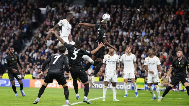 Real Madrid's Antonio Rudiger, top left, and Napoli's Victor Osimhen, top centre, challenge for the ball during the Champions League Group C soccer match between Real Madrid and Napoli at the Santiago Bernabeu stadium in Madrid, Spain, Wednesday, Nov. 29, 2023. (AP Photo/Manu Fernandez)