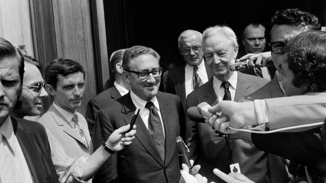 (FILES) Mr. Henry Kissinger, Special Advisor to President Nixon on Security Affairs, leaves the US Embassy alongside US Ambassador to France Arthur Watson and the head of the US delegation to the conference on Vietnam, Mr. David K. E. Bruce on July 12, 1971 in Paris. Former US secretary of state Henry Kissinger, a key figure of American diplomacy in the post-World War II era, died November 29, 2023 at the age of 100, his association said. (Photo by AFP)