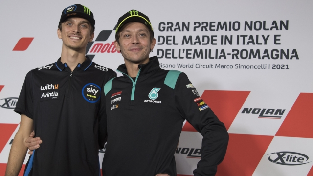 MISANO ADRIATICO, ITALY - OCTOBER 21:  Luca Marini (L) of Italy and SKY VR46 Esponsorama and Valentino Rossi of Italy and Petronas Yamaha SRT pose during the Pre-Event Press Conference during the MotoGP of Emilia Romagna - Previews at Misano World Circuit on October 21, 2021 in Misano Adriatico, Italy. (Photo by Mirco Lazzari gp/Getty Images)
