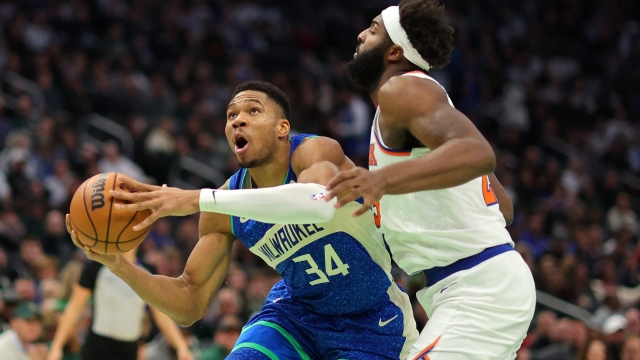 MILWAUKEE, WISCONSIN - DECEMBER 05: Giannis Antetokounmpo #34 of the Milwaukee Bucks drives to the basket against Mitchell Robinson #23 of the New York Knicks during the first half of the NBA In-Season Tournament Quarterfinal at Fiserv Forum on December 05, 2023 in Milwaukee, Wisconsin. NOTE TO USER: User expressly acknowledges and agrees that, by downloading and or using this photograph, User is consenting to the terms and conditions of the Getty Images License Agreement.   Stacy Revere/Getty Images/AFP (Photo by Stacy Revere / GETTY IMAGES NORTH AMERICA / Getty Images via AFP)