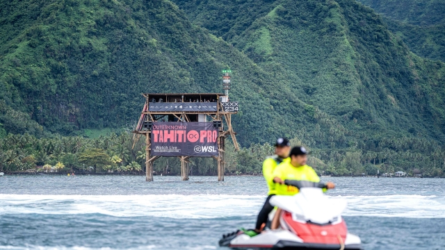 (FILES) Officials ride a  jet-ski during the Outerknown Tahiti Pro 2022, the Women's WSL Championship Tour, in Teahupo'o, French Polynesia on August 16, 2022. President of French Polynesia announced on November 8, 2023 that he would consider moving the 2024 Olympics surf event to a different spot than the mythical Teahupo'o due to the controversial construction of a new tower in the lagoon. (Photo by Jerome Brouillet / AFP)