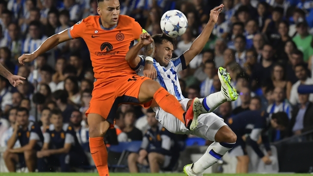 Inter Milan's Lautaro Martinez, left, challenges for the ball with Real Sociedad's Martin Zubimendi during a Group D Champions League soccer match between Real Sociedad and Inter Milan at the Real Arena stadium in San Sebastian, Spain, Wednesday, Sept. 20, 2023. (AP Photo/Alvaro Barrientos)