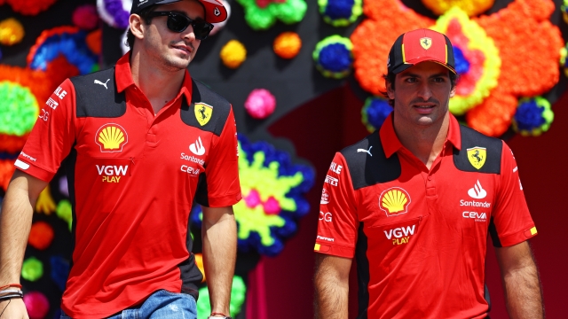 MEXICO CITY, MEXICO - OCTOBER 29: Charles Leclerc of Monaco and Ferrari and Carlos Sainz of Spain and Ferrari look on from the drivers parade prior to the F1 Grand Prix of Mexico at Autodromo Hermanos Rodriguez on October 29, 2023 in Mexico City, Mexico. (Photo by Mark Thompson/Getty Images)