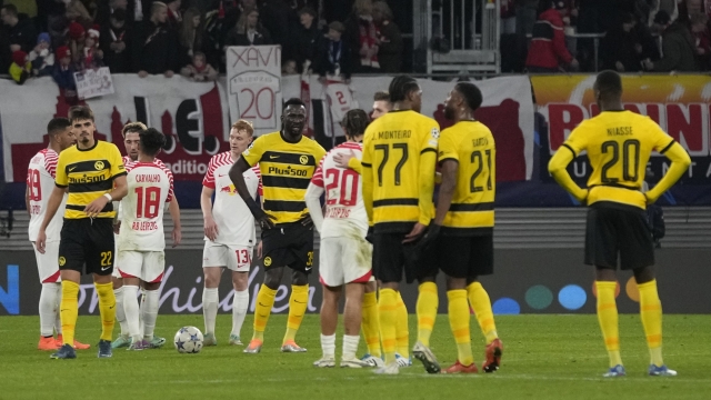 Young Boys players react at the end of the group G Champions League soccer match between RB Leipzig and Young Boys Bern at the Red Bull arena stadium in Leipzig, Germany, Wednesday, Dec. 13, 2023. (AP Photo/Matthias Schrader)