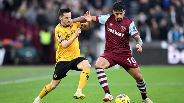 LONDON, ENGLAND - DECEMBER 17: Pablo Sarabia of Wolverhampton Wanderers challenges for the ball with Lucas Paqueta of West Ham United during the Premier League match between West Ham United and Wolverhampton Wanderers at London Stadium on December 17, 2023 in London, England. (Photo by Justin Setterfield/Getty Images)