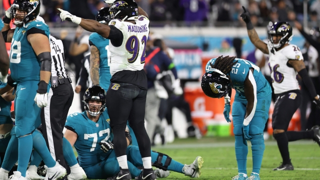 JACKSONVILLE, FLORIDA - DECEMBER 17: Justin Madubuike #92 of the Baltimore Ravens celebrates after his forced fumble against the Jacksonville Jaguars during the fourth quarter at EverBank Stadium on December 17, 2023 in Jacksonville, Florida. Madubuike tied an NFL record for 11 straight games with at least .5 sacks.   Mike Carlson/Getty Images/AFP (Photo by Mike Carlson / GETTY IMAGES NORTH AMERICA / Getty Images via AFP)