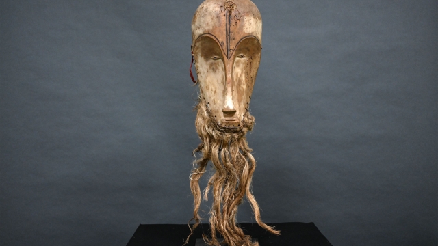 (FILES) (FILES) This photograph taken on March 24, 2022 shows a "Ngil" mask of the Fang people of Gabon which is estimated at 300,000/400,000 euros and which will be auctioned on March 26, 2022 at the Montpellier auction house. A retired couple from the south of France have taken legal action to overturn the sale of a Central African mask they owned to a secondhand dealer for 150 euros, which was subsequently resold for over four million euros. (Photo by Pascal GUYOT / AFP)