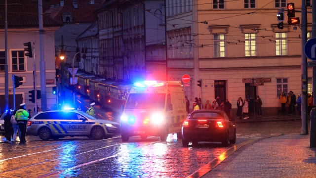 epa11039961 An ambulance rushes to the scene of a shooting in central Prague, 21 December 2023. According to Czech Police several people have been killed and "dozens" injured in an incident in the capital of the Czech Republic.  EPA/MARTIN DIVISEK