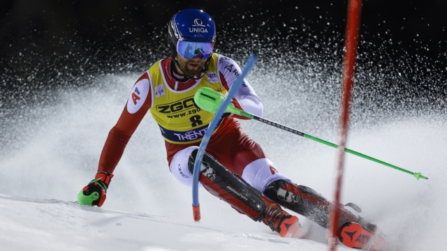Austria's Marco Schwarz speeds down the course during an alpine ski, men's World Cup slalom, in Madonna di Campiglio, Italy, Friday, Dec. 22, 2023. (AP Photo/Alessandro Trovati)