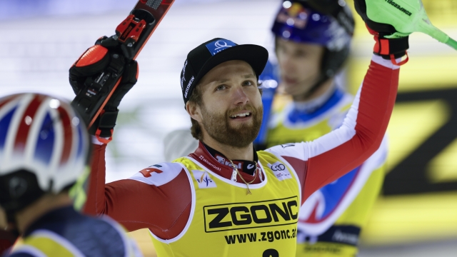Austria's Marco Schwarz celebrates winning an alpine ski, men's World Cup slalom, in Madonna di Campiglio, Italy, Friday, Dec. 22, 2023. (AP Photo/Alessandro Trovati)