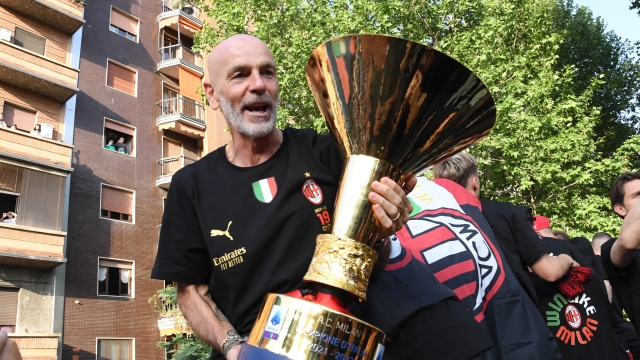 MILAN, ITALY - MAY 23: Head coach of AC Milan Stefano Pioli celebrate with fans victory parade of "Scudetto" Championship in an open-top bus through the streets of Milan on May 23, 2022 in Milan, Italy. (Photo by Claudio Villa/AC Milan via Getty Images)