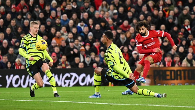 LIVERPOOL, ENGLAND - DECEMBER 23: Mohamed Salah of Liverpool scores their team's first goal during the Premier League match between Liverpool FC and Arsenal FC at Anfield on December 23, 2023 in Liverpool, England. (Photo by Michael Regan/Getty Images)