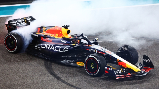 ABU DHABI, UNITED ARAB EMIRATES - NOVEMBER 26: Race winner Max Verstappen of the Netherlands driving the (1) Oracle Red Bull Racing RB19 performs donuts on track during the F1 Grand Prix of Abu Dhabi at Yas Marina Circuit on November 26, 2023 in Abu Dhabi, United Arab Emirates. (Photo by Clive Rose/Getty Images)