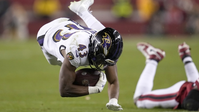 Baltimore Ravens running back Justice Hill (43) falls forward after being tackled against the San Francisco 49ers during the second half of an NFL football game in Santa Clara, Calif., Monday, Dec. 25, 2023. (AP Photo/Godofredo A. Vásquez)