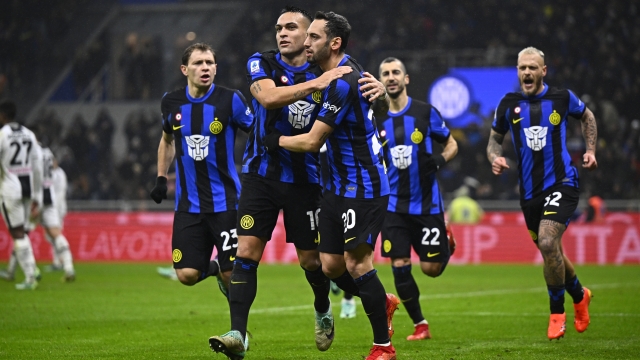 MILAN, ITALY - DECEMBER 09: Lautaro Martinez of FC Internazionale celebrates after scoring his team's fourth goal with teammate Hakan Calhanoglu during the Serie A TIM match between FC Internazionale and Udinese Calcio at Stadio Giuseppe Meazza on December 09, 2023 in Milan, Italy. (Photo by Mattia Ozbot - Inter/Inter via Getty Images)