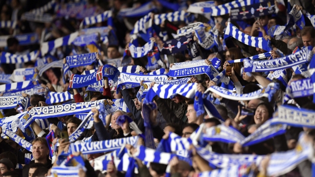 Real Sociedad supporters cheers their team during a Champions League Group D soccer match between Real Sociedad and Salzburg at the Reala Arena stadium in San Sebastian, Spain, Wednesday, Nov.29, 2023. (AP Photo/Alvaro Barrientos)