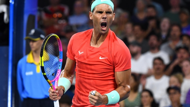 epa11053211 Rafael Nadal of Spain celebrates a point against Dominic Thiem of Austria during their match on Day 3 of the 2024 Brisbane International tennis tournament in Brisbane, Australia, 02 January 2024.  EPA/JONO SEARLE  AUSTRALIA AND NEW ZEALAND OUT  EDITORIAL USE ONLY  EDITORIAL USE ONLY
