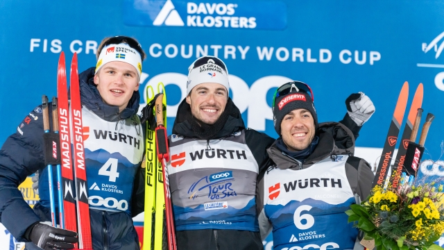 DAVOS, SWITZERLAND - JANUARY 3: Lucas Chavanat takes 1st place, Edvin Anger of Team Sweden takes 2nd place, Federico Pellegrino of Team Italy takes 3rd place during the FIS Cross Country World Cup Men's and Women's Sprint on January 3, 2024 in Davos, Switzerland. (Photo by Paul Brechu/Agence Zoom/Getty Images)