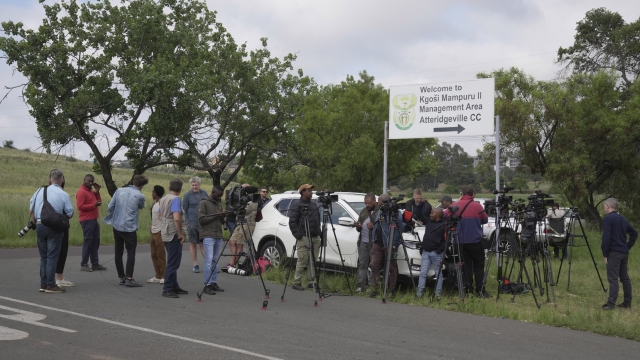 Television crews, photographers and reporters gather outside the gates of the Atteridgeville Correctional Center in the South African capital of Pretoria, South Africa, waiting to catch a glimpse of the world-famous double-amputee Olympic runner, Oscar Pistorius, to be released Friday, Jan 5, 2024. Pistorius is due to be released from prison on parole more than a decade after he shot girlfriend Reeva Steenkamp in a Valentine's Day killing that shattered the reputation of the sporting superstar. (AP Photo/Tsavngirayi Mukwazhi)