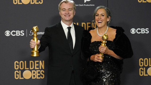 Christopher Nolan, left, and Emma Thomas pose in the press room with the award for best motion picture, drama for "Oppenheimer" at the 81st Golden Globe Awards on Sunday, Jan. 7, 2024, at the Beverly Hilton in Beverly Hills, Calif. (AP Photo/Chris Pizzello)