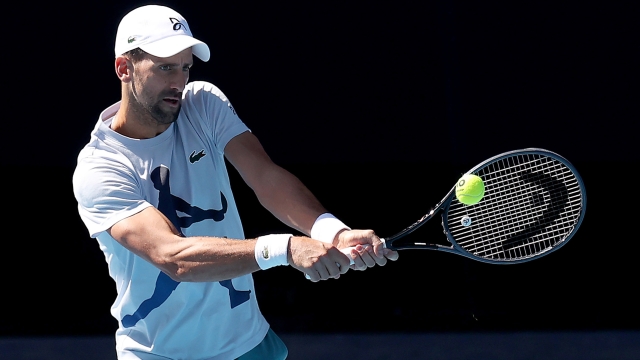 MELBOURNE, AUSTRALIA - JANUARY 09: Novak Djokovic of Serbia plays a backhand during a training session ahead of the 2024 Australian Open at Melbourne Park on January 09, 2024 in Melbourne, Australia. (Photo by Kelly Defina/Getty Images)