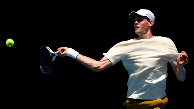 MELBOURNE, AUSTRALIA - JANUARY 06: Jannik Sinner of Italy plays a forehand during a training session ahead of the 2024 Australian Open at Melbourne Park on January 06, 2024 in Melbourne, Australia. (Photo by Graham Denholm/Getty Images)