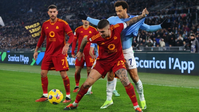ROME, ITALY - JANUARY 10: Gianluca Mancini of AS Roma battles for possession with Felipe Anderson of SS Lazio during the Coppa Italia match between SS Lazio and AS Roma at Stadio Olimpico on January 10, 2024 in Rome, Italy. (Photo by Paolo Bruno/Getty Images)