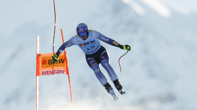 Italy's Dominik Paris is airborne during an alpine ski, men's World Cup downhill race, in Wengen, Switzerland, Thursday, Jan. 11, 2024. (AP Photo/Alessandro Trovati)