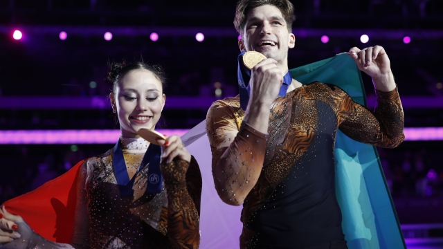 Winners Lucrezia Beccari and Matteo Guarise of Italy pose with gold medals after the medal ceremony for the pairs competition during the ISU European Figure Skating Championships in Kaunas, Lithuania, Thursday, Jan. 11, 2024. (AP Photo/Mindaugas Kulbis)