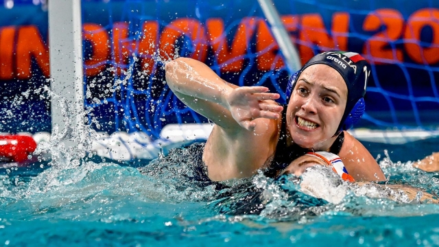 Giulia Viacava of Italy fight for the ball during the semifinal match between team Netherlands (white cap) vs. team Italy (blue cap) of the European Water Polo Championship Women 2024 at Pieter van den Hoogenband Zwemstadion in Eindhoven (Netherlands), January 11th, 2024.