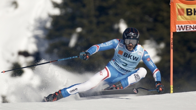 France's Cyprien Sarrazin speeds down the course during an alpine ski, men's World Cup super-G race, in Wengen, Switzerland, Friday, Jan. 12, 2024. (AP Photo/Gabriele Facciotti)