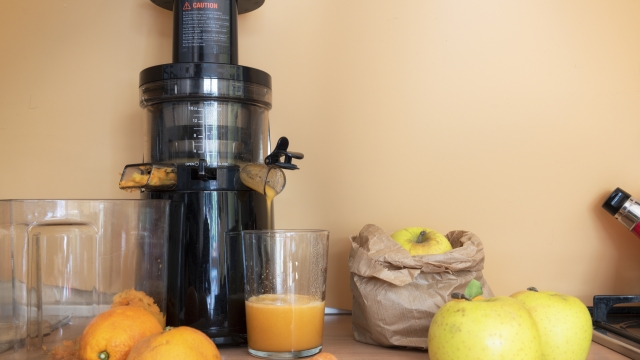 juice extractor for a good breakfast with apples carrots and orange centrifuge
