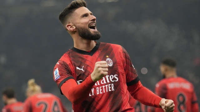 AC Milan's Olivier Giroud celebrates after scoring his side's second goal during the Serie A soccer match between AC Milan and Roma at the San Siro stadium in Milan, Italy, Sunday, Jan. 14, 2024. (AP Photo/Luca Bruno)