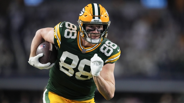 Green Bay Packers tight end Luke Musgrave runs in a touchdown after making a catch against the Dallas Cowboys during the second half of an NFL football game, Sunday, Jan. 14, 2024, in Arlington, Texas. (AP Photo/Sam Hodde)
