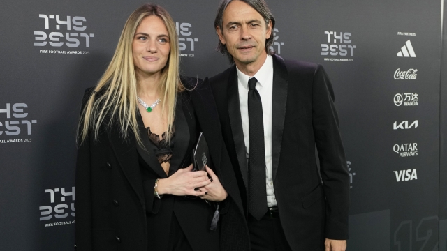 Inter Milan's coach Simone Inzaghi and partner Angela Robusti arrive for the FIFA Football Awards 2023 at the Eventim Apollo in Hammersmith, London, Monday, Jan. 15, 2024. (AP Photo/Kirsty Wigglesworth)