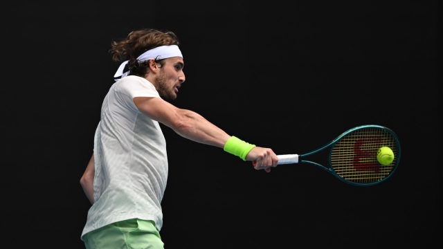 epa11088838 Stefanos Tsitsipas of Greece in action during his 3rd round match against Luca Van Assche of France on Day 6 of the 2024 Australian Open at Melbourne Park in Melbourne, Australia, 19 January 2024.  EPA/LUKAS COCH AUSTRALIA AND NEW ZEALAND OUT