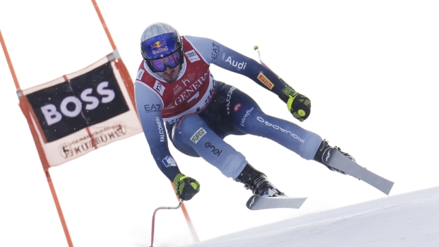 Italy's Dominik Paris speeds down the course during an alpine ski, men's World Cup downhill, in Kitzbuehel, Austria, Friday, Jan. 19, 2024. (AP Photo/Giovanni Auletta)