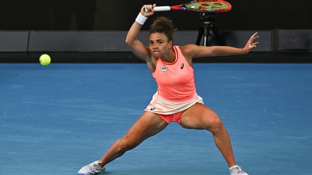Italy's Jasmine Paolini hits a return against Russia's Anna Kalinskaya during their women's singles match on day nine of the Australian Open tennis tournament in Melbourne on January 22, 2024. (Photo by Lillian SUWANRUMPHA / AFP) / -- IMAGE RESTRICTED TO EDITORIAL USE - STRICTLY NO COMMERCIAL USE --